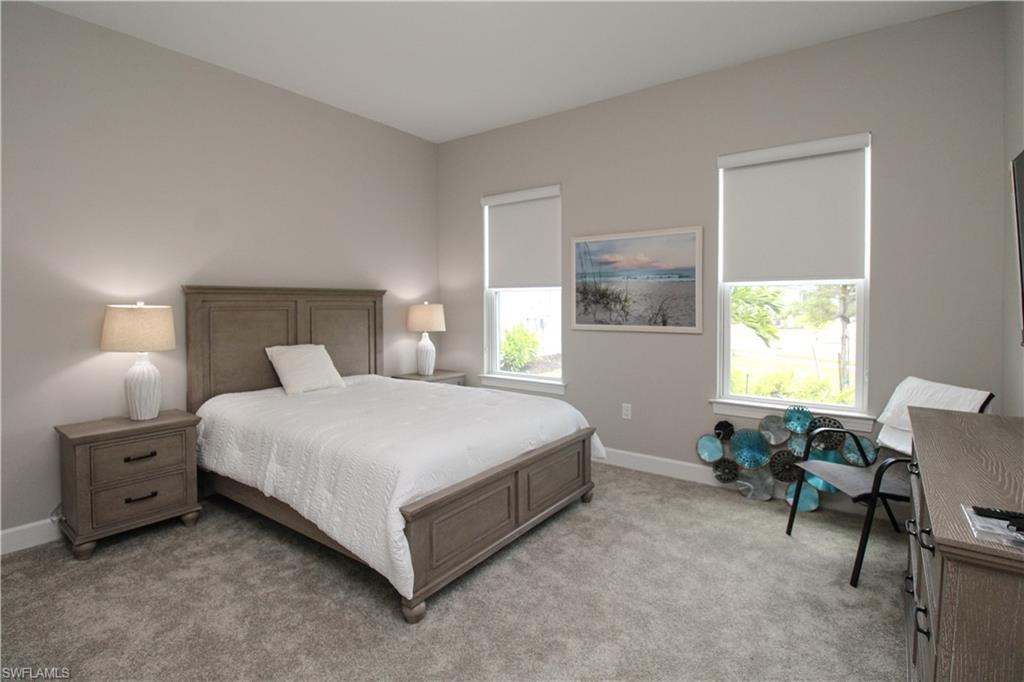 15765 Cortina Street Naples, FL 34114 - Photo 11 of 50 a bedroom with a bed and a window