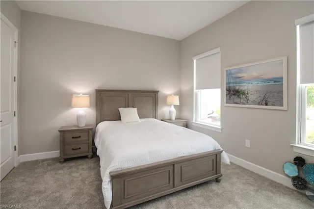 a bedroom with a bed and night stand