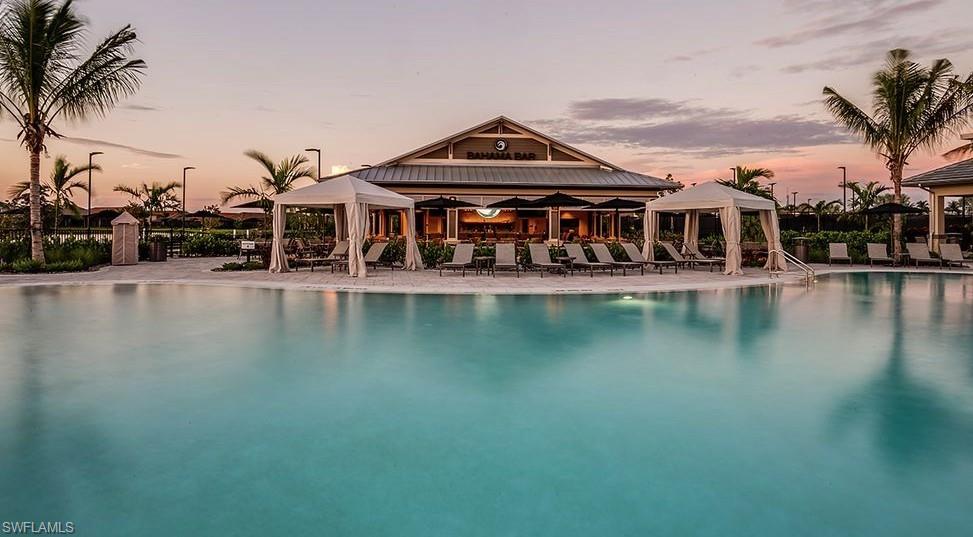 15765 Cortina Street Naples, FL 34114 - Photo 2 of 50 a view of a building with river in front of it