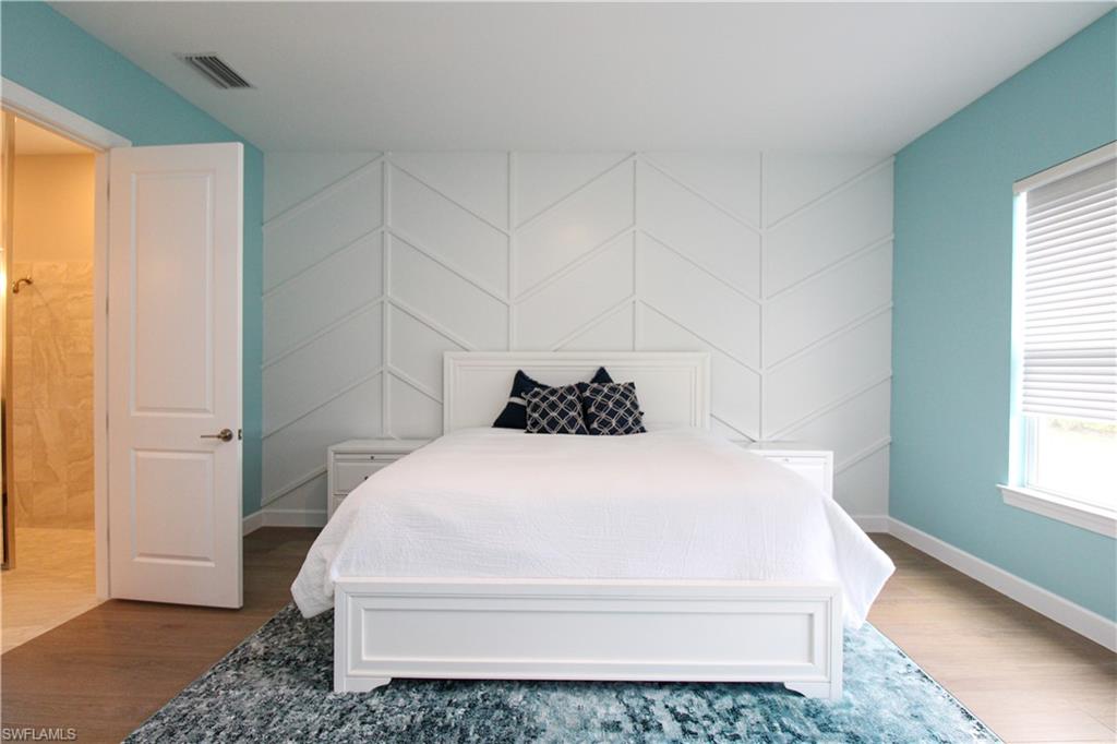 15765 Cortina Street Naples, FL 34114 - Photo 33 of 50 a bathroom with a bathtub