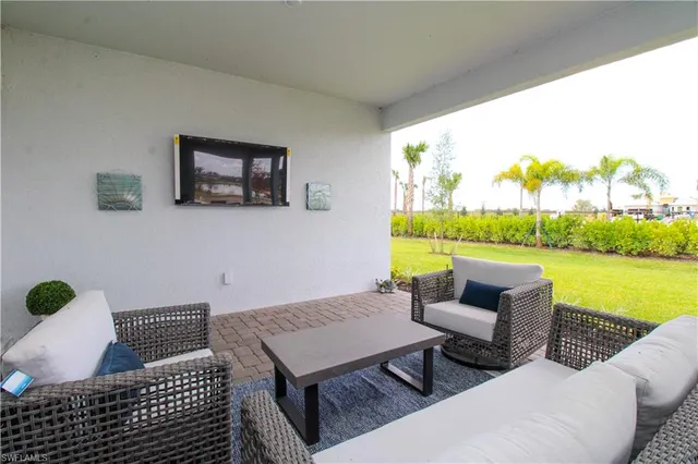 a balcony with a table and chairs