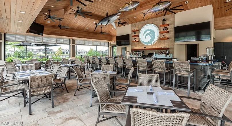 15765 Cortina Street Naples, FL 34114 - Photo 48 of 50 a view of a dining room with furniture window and outside view