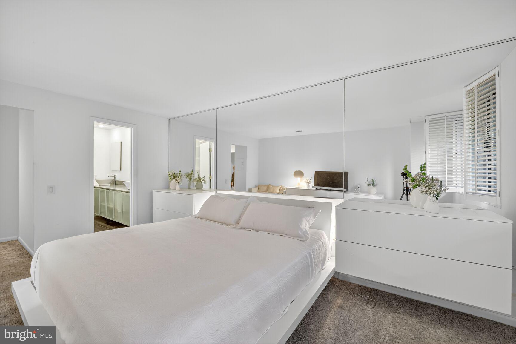 4100 Cathedral Avenue Northwest, Unit 615 Washington, DC 20016 - Photo 11 of 26 a large white bed in a white room