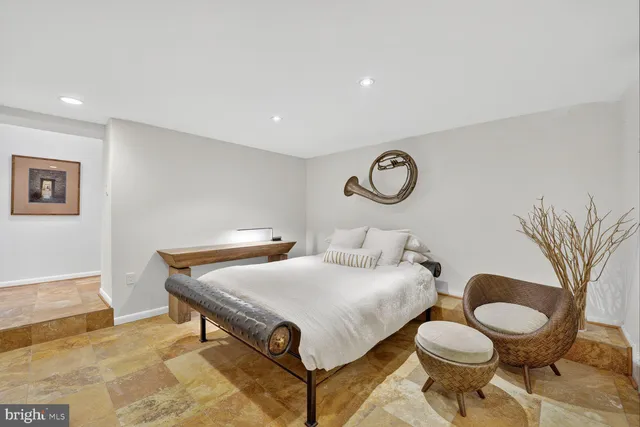 a living room with furniture and a rug