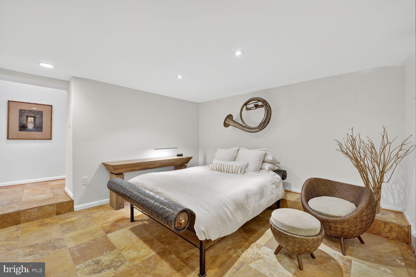 4100 Cathedral Avenue Northwest, Unit 615 Washington, DC 20016 - Photo 13 of 26 a living room with furniture and a rug
