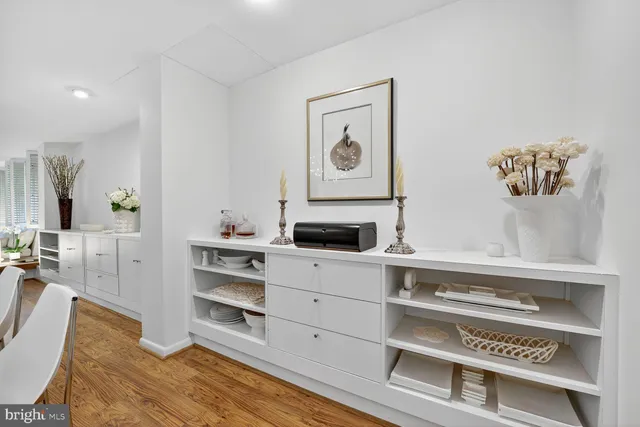 walk in closet with view of living room