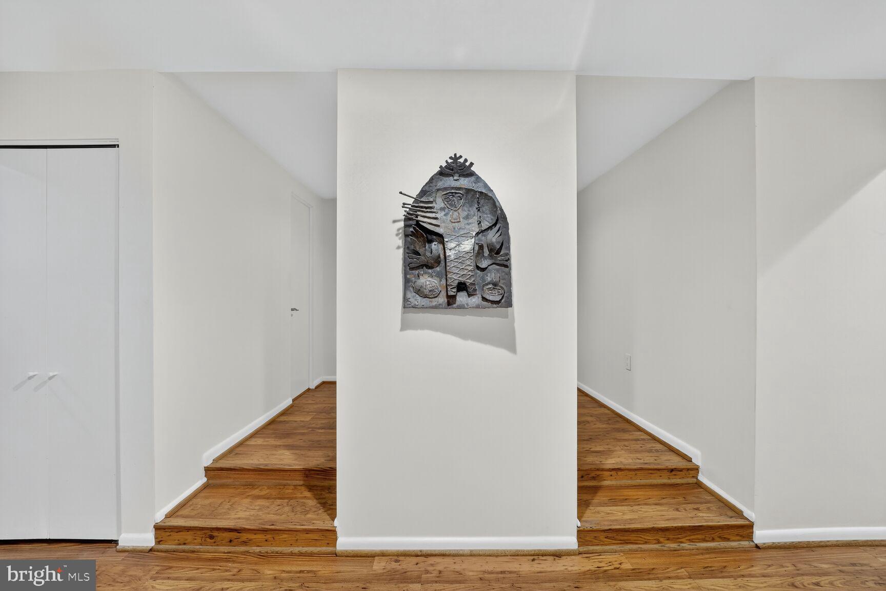 4100 Cathedral Avenue Northwest, Unit 615 Washington, DC 20016 - Photo 18 of 26 a view of a hallway with wooden floor and entryway