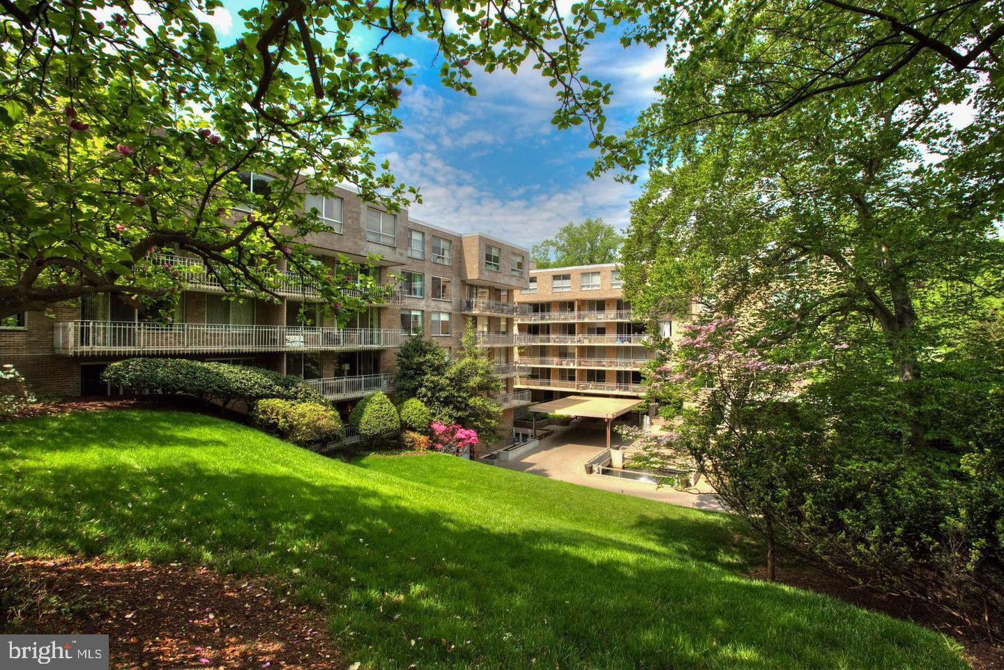 4100 Cathedral Avenue Northwest, Unit 615 Washington, DC 20016 - Photo 2 of 26 a view of a backyard with plants and a patio