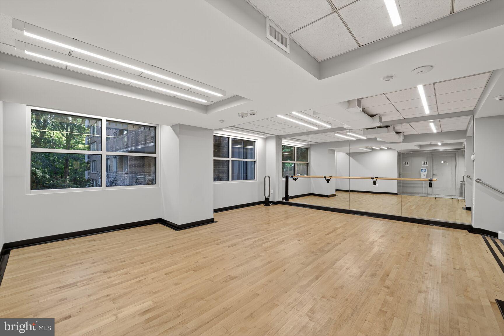 4100 Cathedral Avenue Northwest, Unit 615 Washington, DC 20016 - Photo 22 of 26 a view of an empty room with a window and chandelier