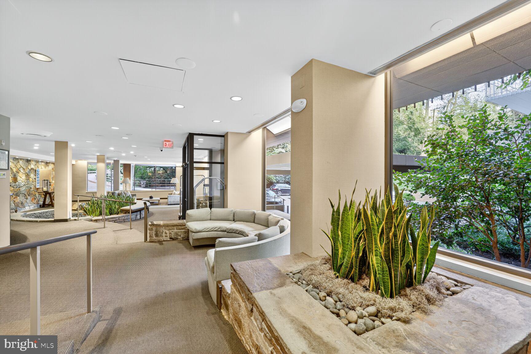 4100 Cathedral Avenue Northwest, Unit 615 Washington, DC 20016 - Photo 24 of 26 a living room with patio furniture and a potted plant