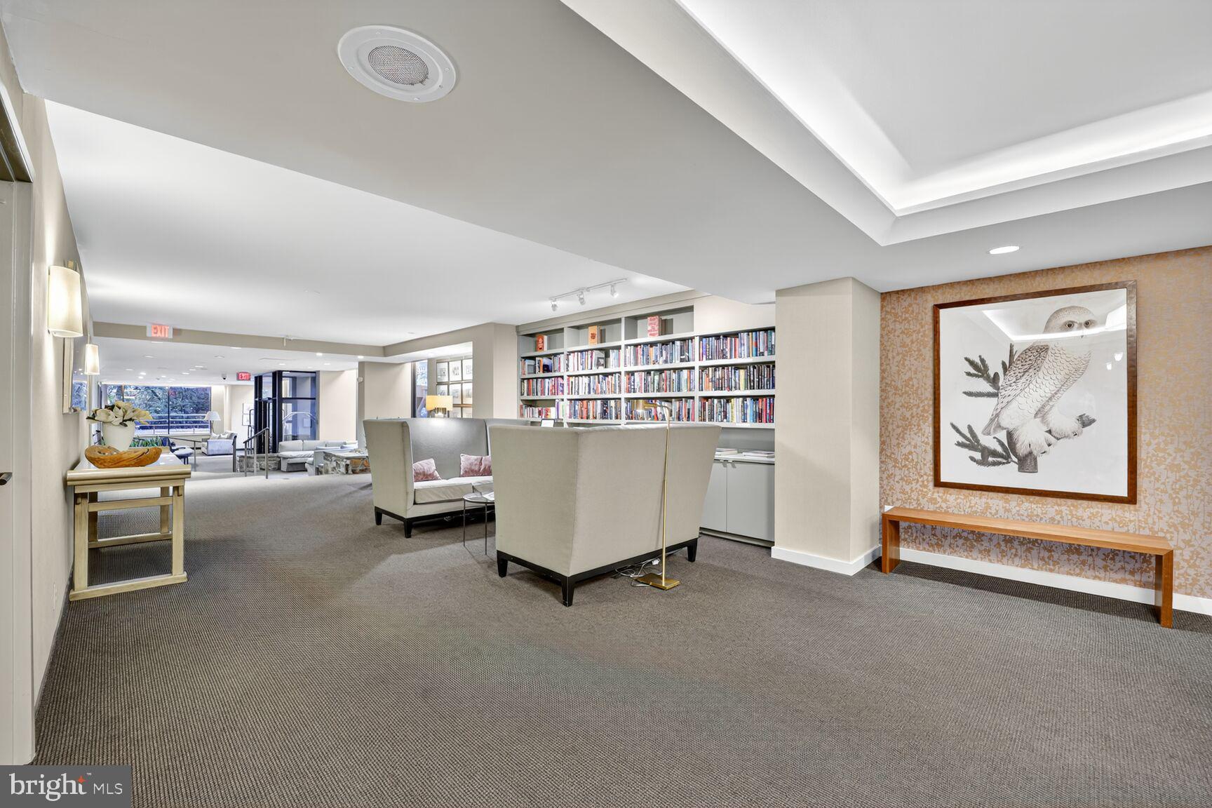 4100 Cathedral Avenue Northwest, Unit 615 Washington, DC 20016 - Photo 25 of 26 a living room with furniture and a book shelf