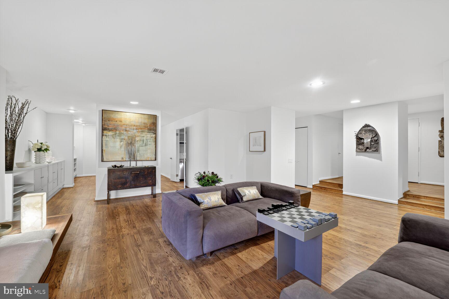 4100 Cathedral Avenue Northwest, Unit 615 Washington, DC 20016 - Photo 4 of 26 a living room with furniture and wooden floor