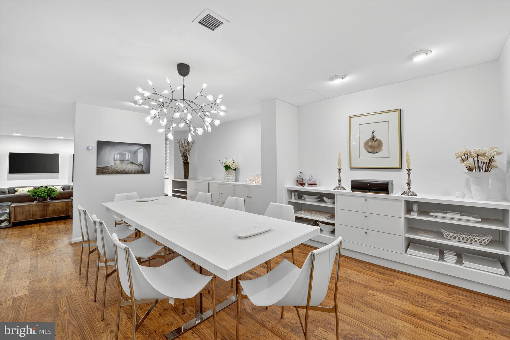 4100 Cathedral Avenue Northwest, Unit 615 Washington, DC 20016 - Photo 6 of 26 a view of a dining room with furniture and wooden floor