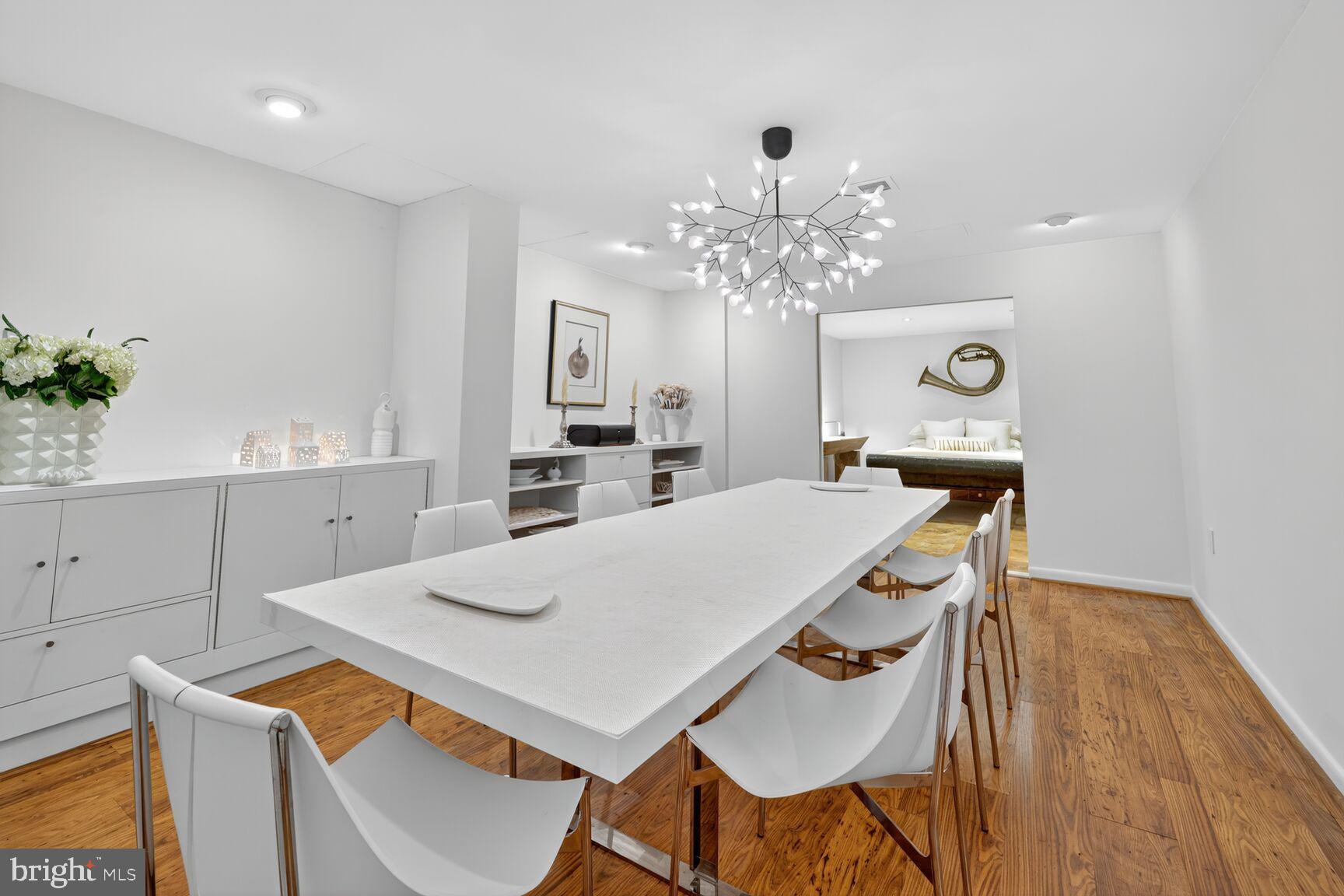 4100 Cathedral Avenue Northwest, Unit 615 Washington, DC 20016 - Photo 7 of 26 a view of a dining room with furniture and wooden floor