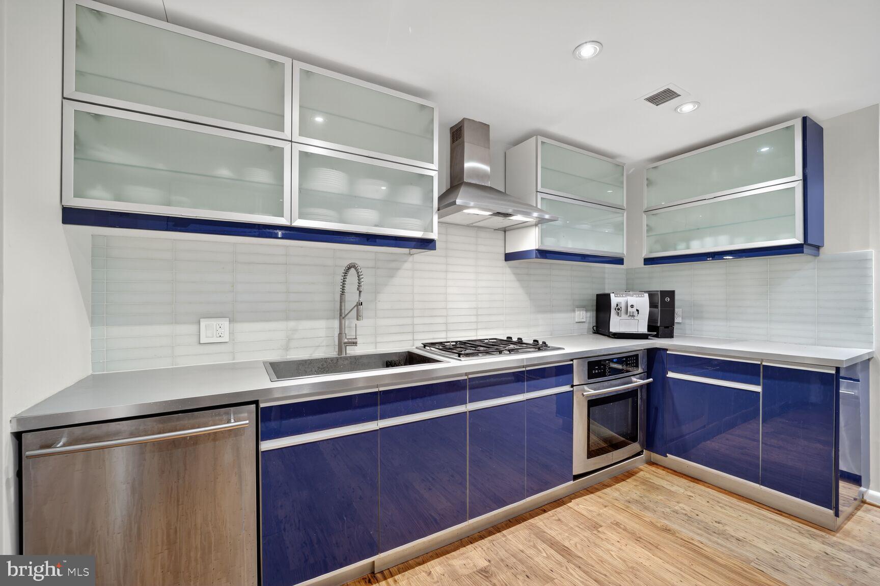 4100 Cathedral Avenue Northwest, Unit 615 Washington, DC 20016 - Photo 8 of 26 a kitchen with stainless steel appliances granite countertop a sink stove and cabinets