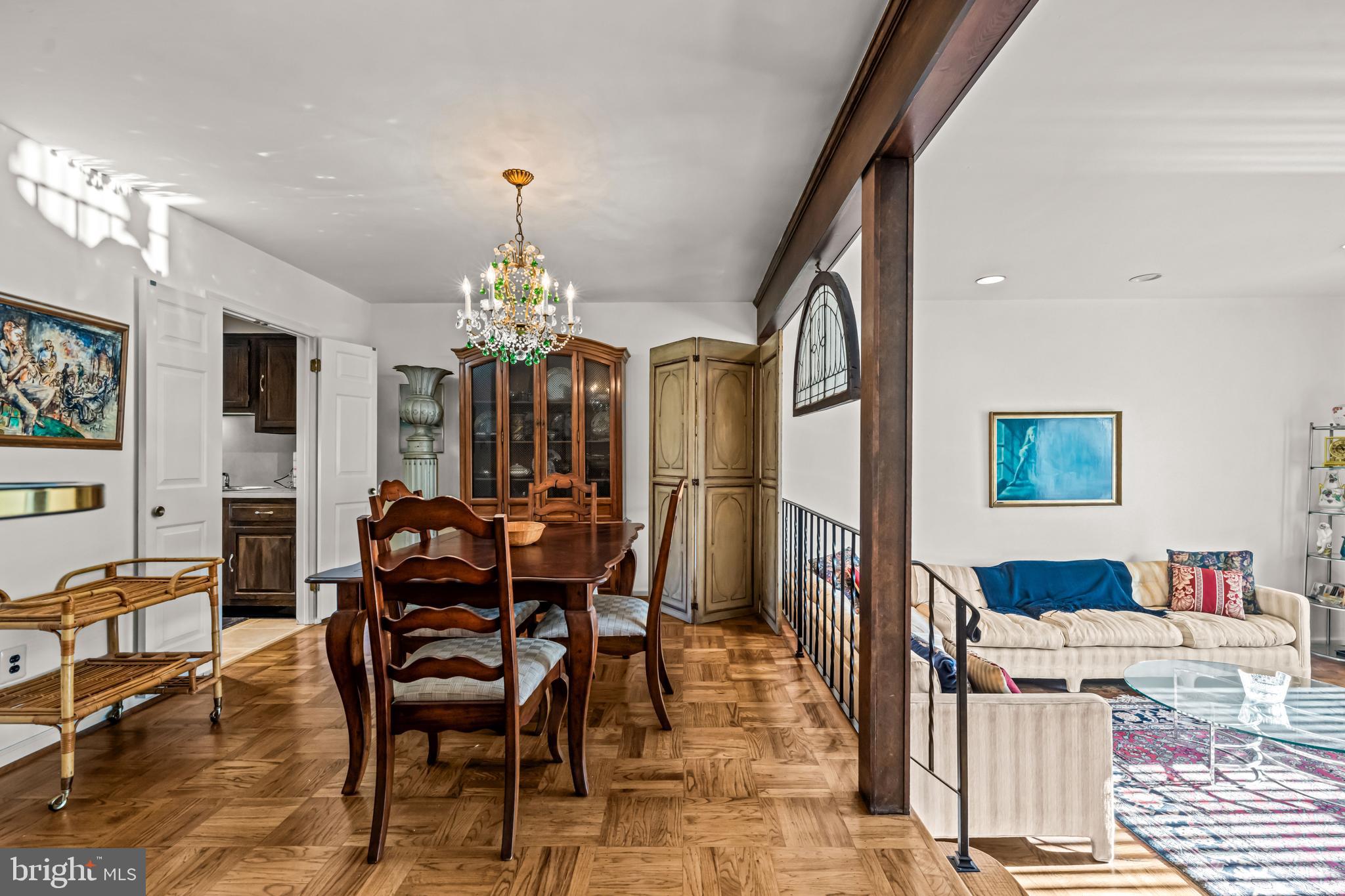 633 East Main Street, Unit B7 Moorestown, NJ 08057 - Photo 16 of 42 a view of a dining room with furniture and chandelier