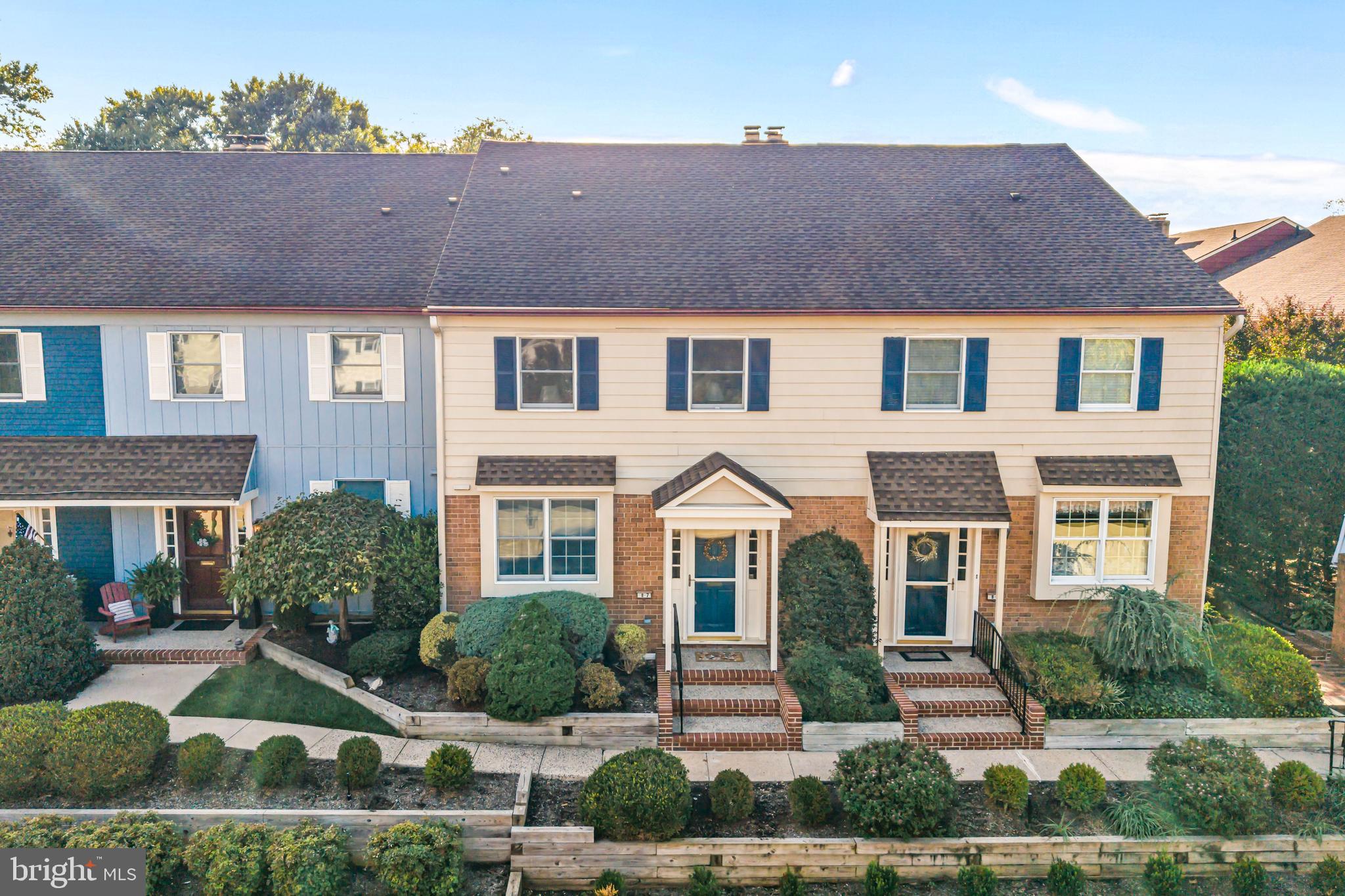 633 East Main Street, Unit B7 Moorestown, NJ 08057 - Photo 2 of 42 a front view of a house with a yard