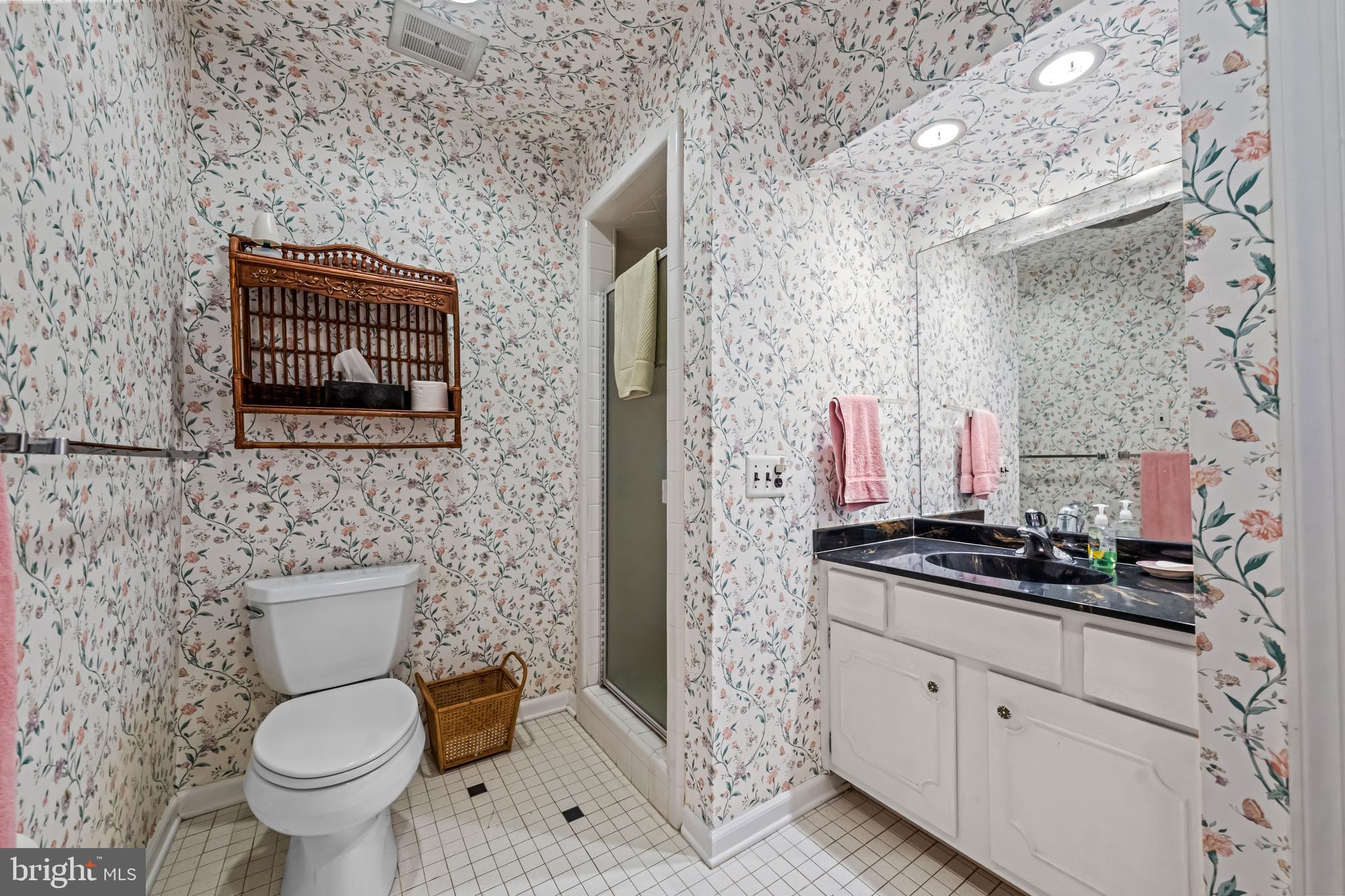 633 East Main Street, Unit B7 Moorestown, NJ 08057 - Photo 22 of 42 a bathroom with a toilet sink and mirror