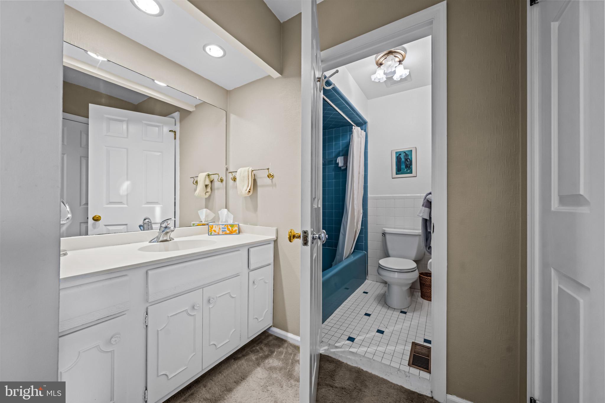 633 East Main Street, Unit B7 Moorestown, NJ 08057 - Photo 23 of 42 a en suite bathroom with a sink mirror and toilet