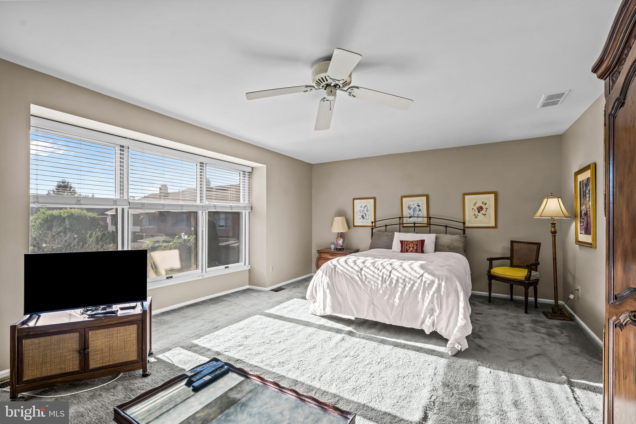 633 East Main Street, Unit B7 Moorestown, NJ 08057 - Photo 26 of 42 a bedroom with a bed and wooden floor