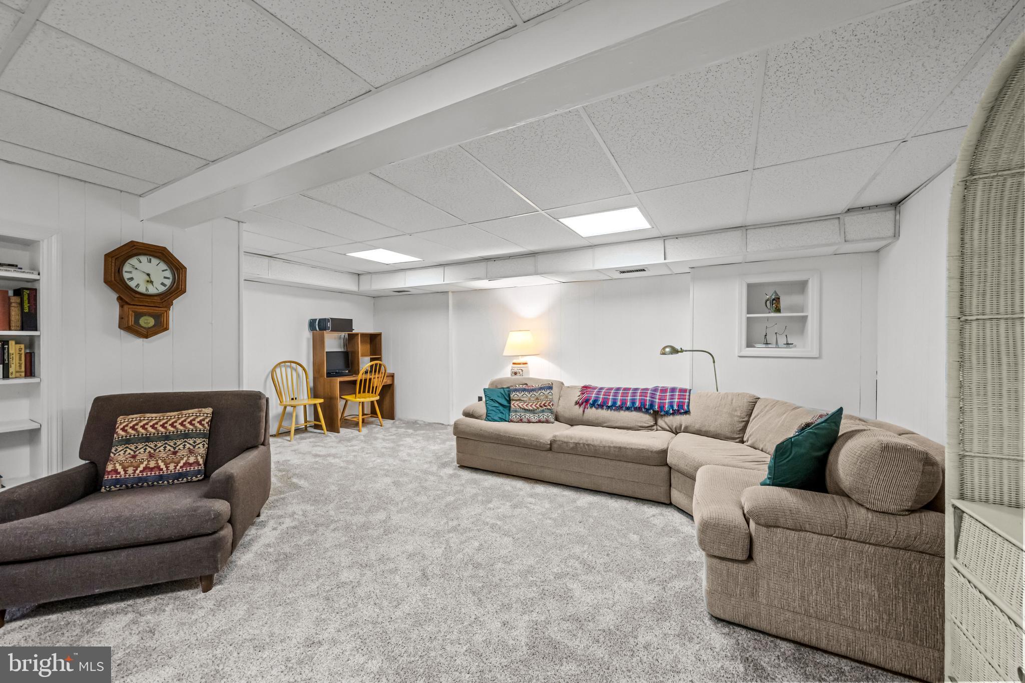 633 East Main Street, Unit B7 Moorestown, NJ 08057 - Photo 28 of 42 a living room with furniture and a lamp