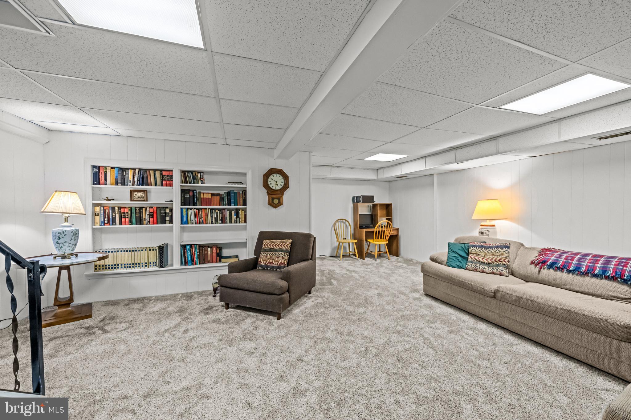 633 East Main Street, Unit B7 Moorestown, NJ 08057 - Photo 29 of 42 a living room with furniture and a book shelf