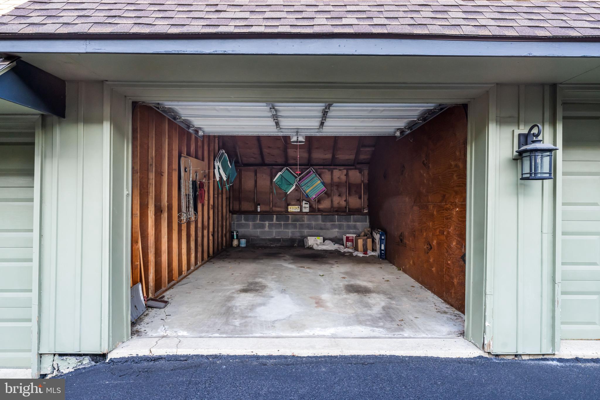 633 East Main Street, Unit B7 Moorestown, NJ 08057 - Photo 31 of 42 a view of a garage door and wooden floor