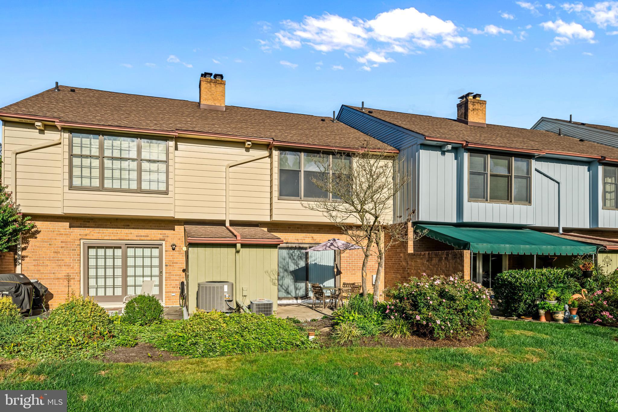 633 East Main Street, Unit B7 Moorestown, NJ 08057 - Photo 33 of 42 a front view of a house with a yard