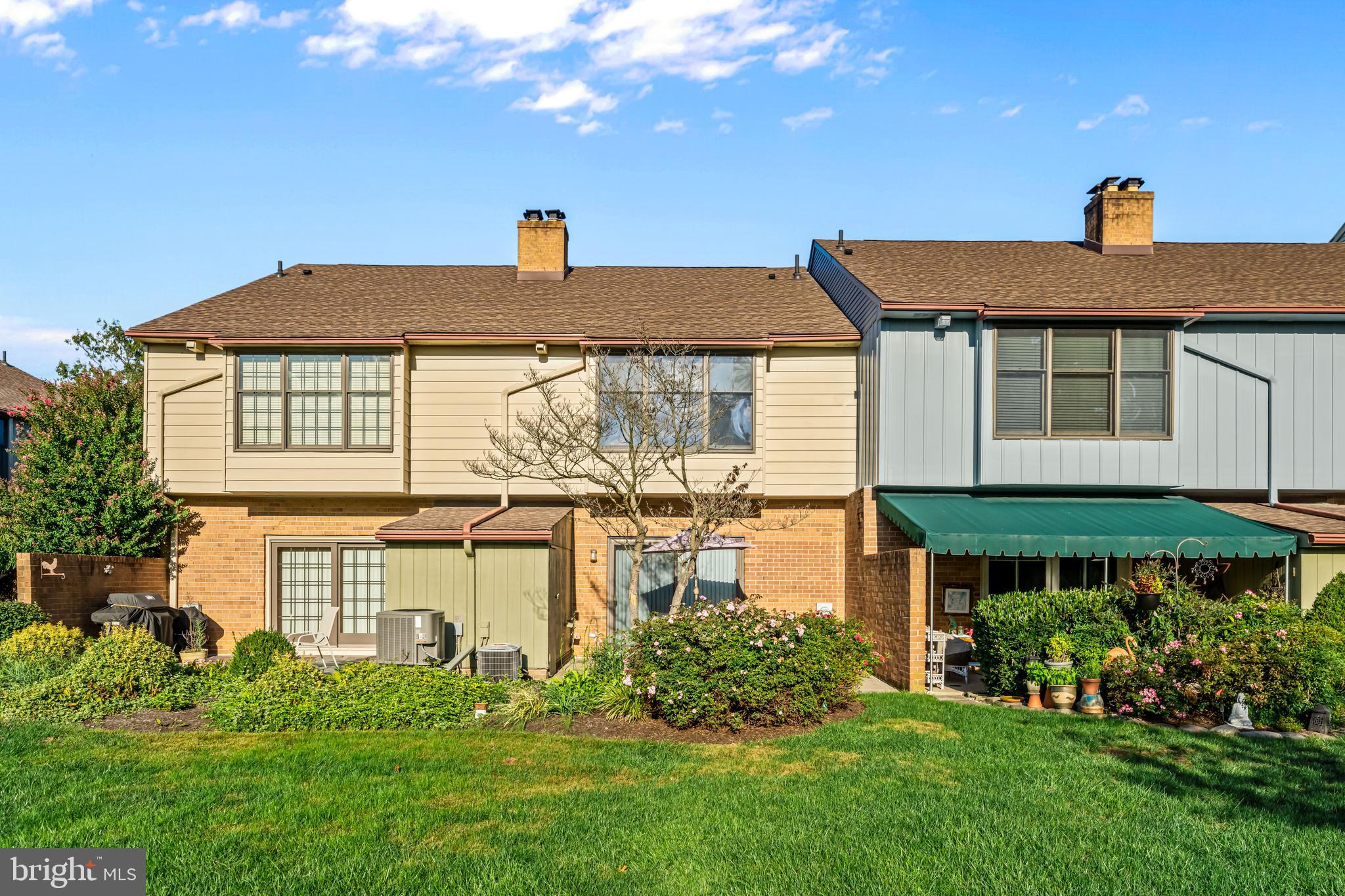 633 East Main Street, Unit B7 Moorestown, NJ 08057 - Photo 34 of 42 a front view of a house with a yard