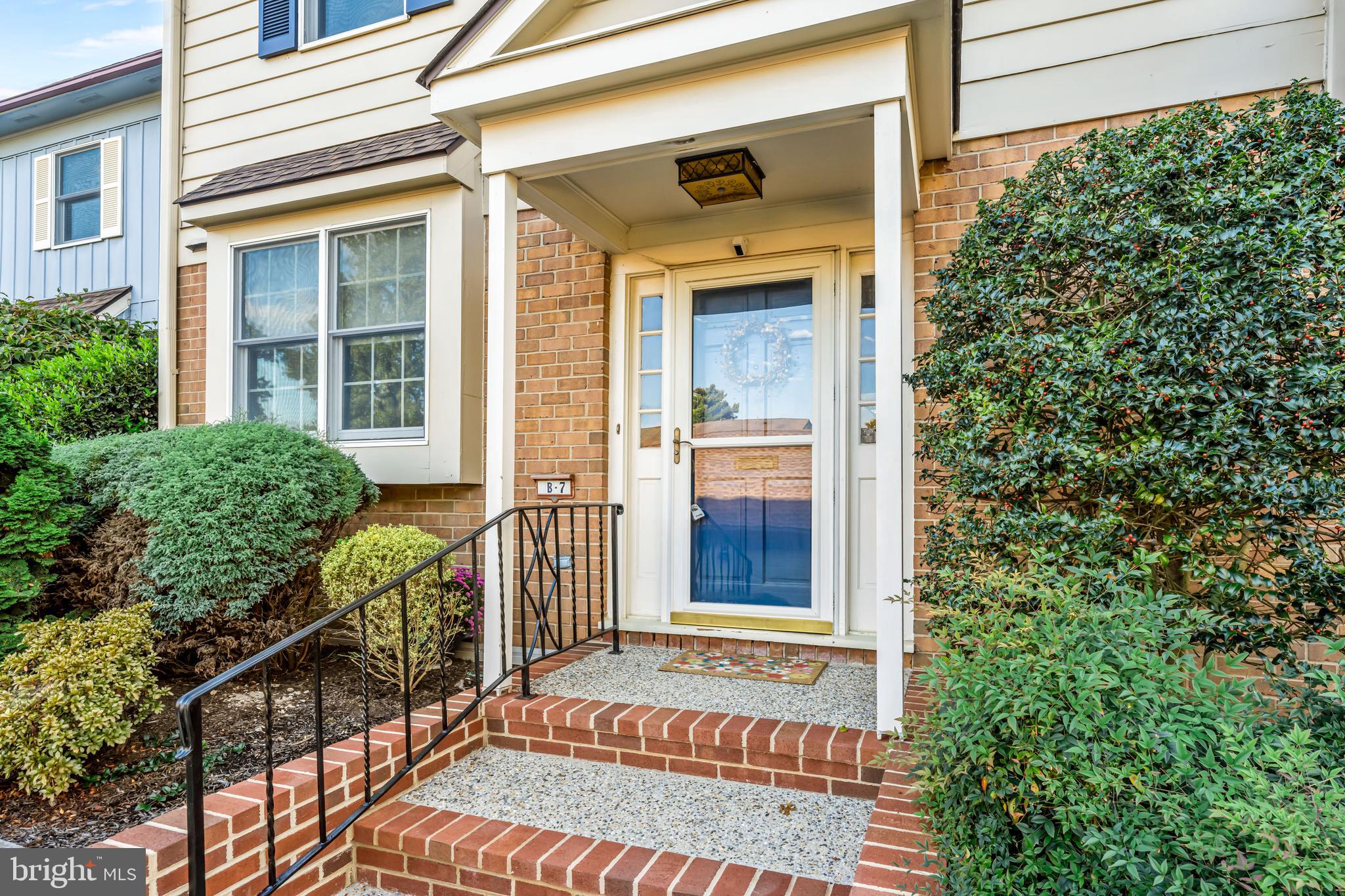 633 East Main Street, Unit B7 Moorestown, NJ 08057 - Photo 4 of 42 a front view of a house with a porch
