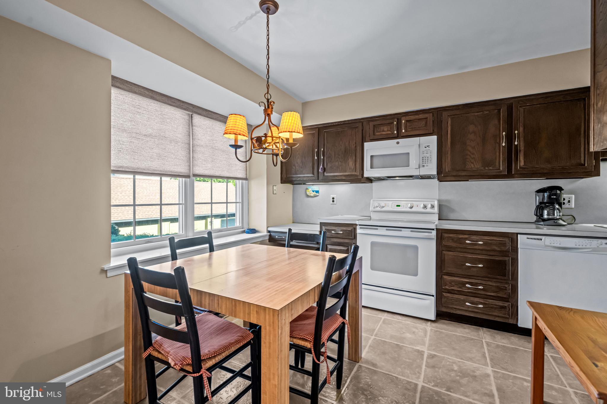 633 East Main Street, Unit B7 Moorestown, NJ 08057 - Photo 7 of 42 a view of a dining room with furniture window and wooden floor