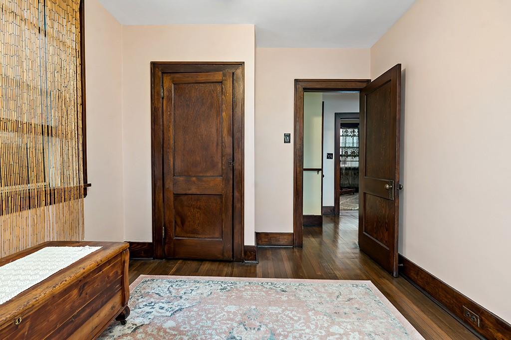 1218 Holmes Street McKees Rocks, PA 15136 - Photo 12 of 32 view of room with window and hardwood floor