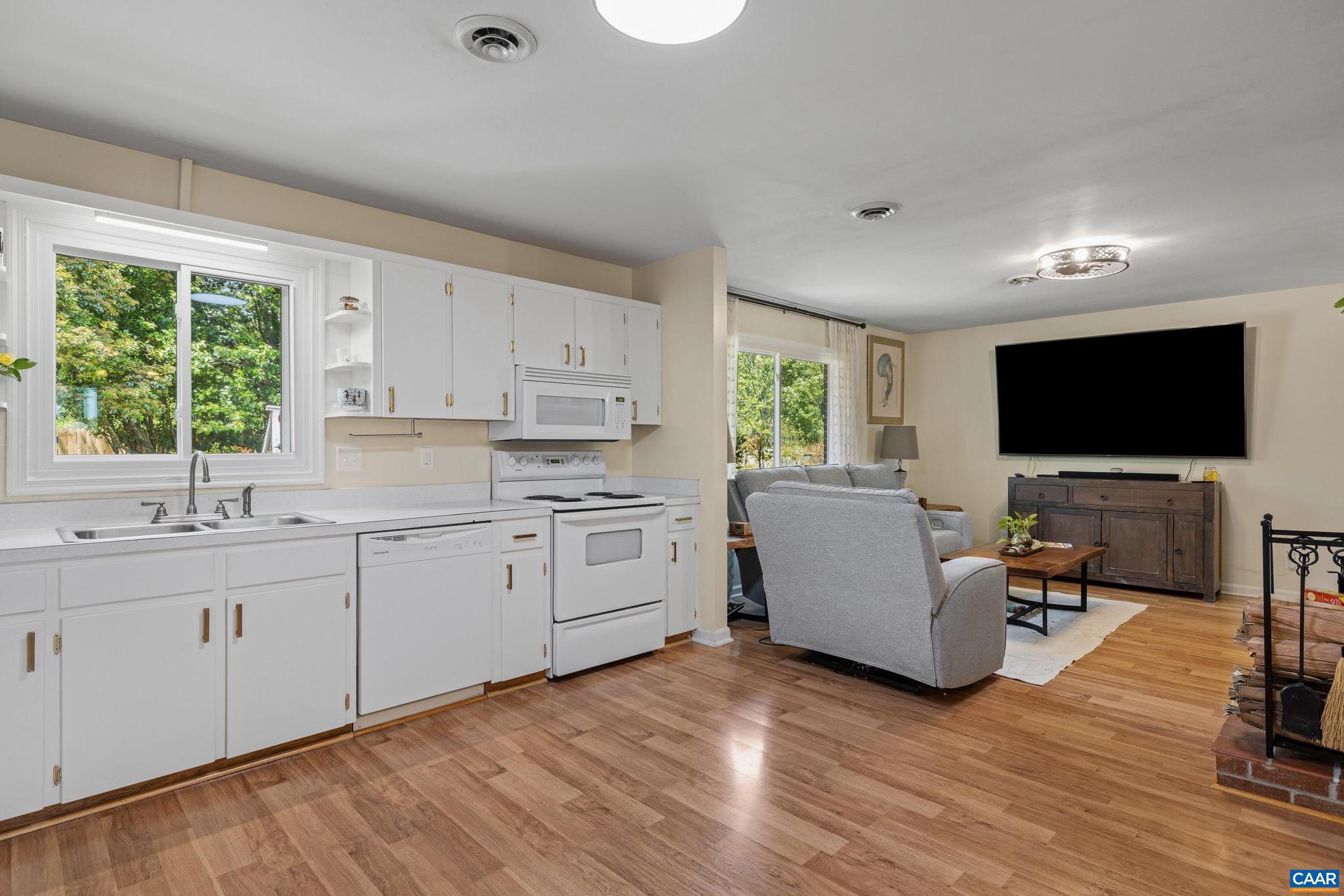 752 Westwood Road Stanardsville, VA 22973 - Photo 14 of 63 a open kitchen with white cabinets a sink and a window
