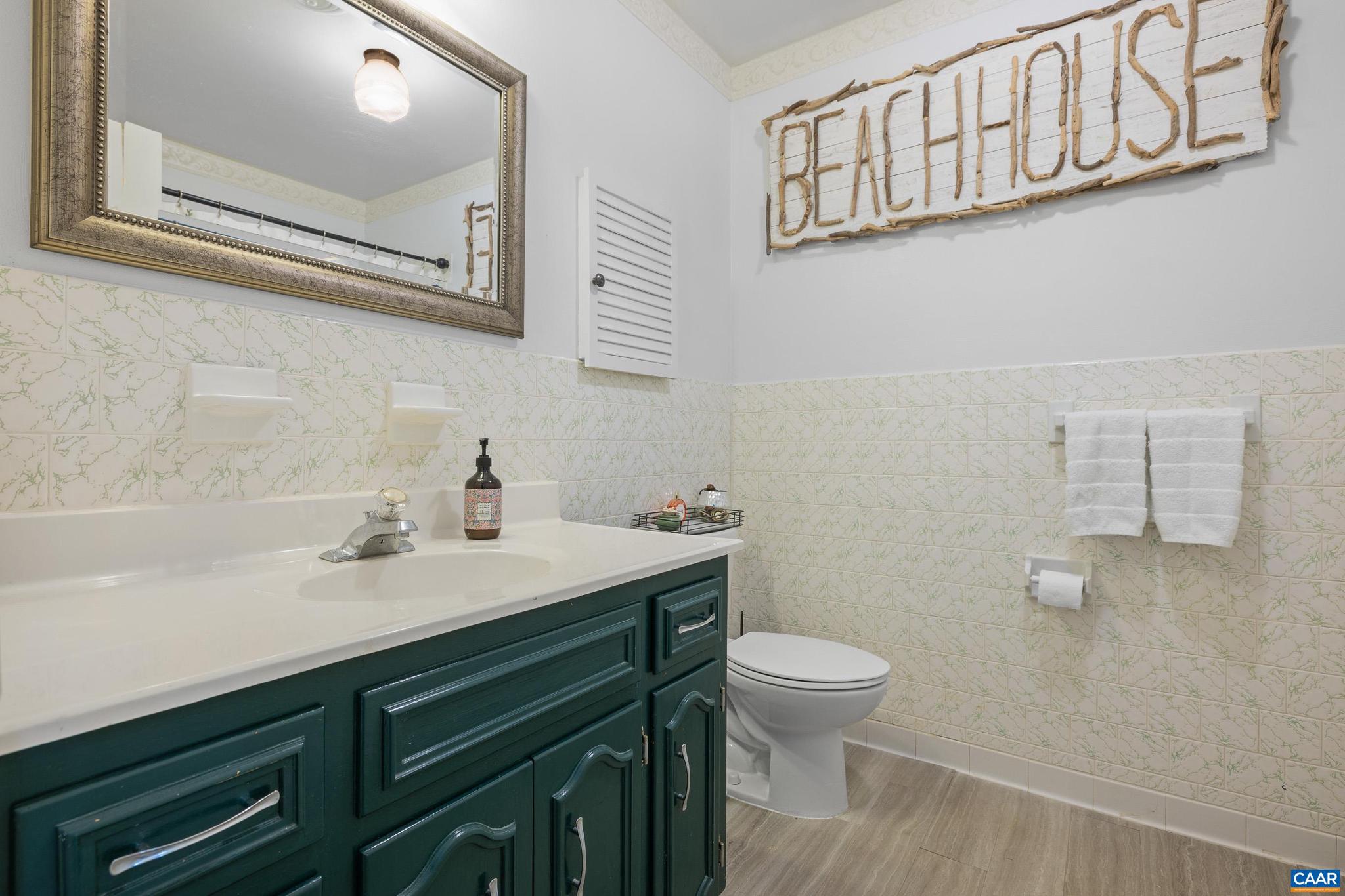 752 Westwood Road Stanardsville, VA 22973 - Photo 27 of 63 a bathroom with a sink a toilet and a mirror