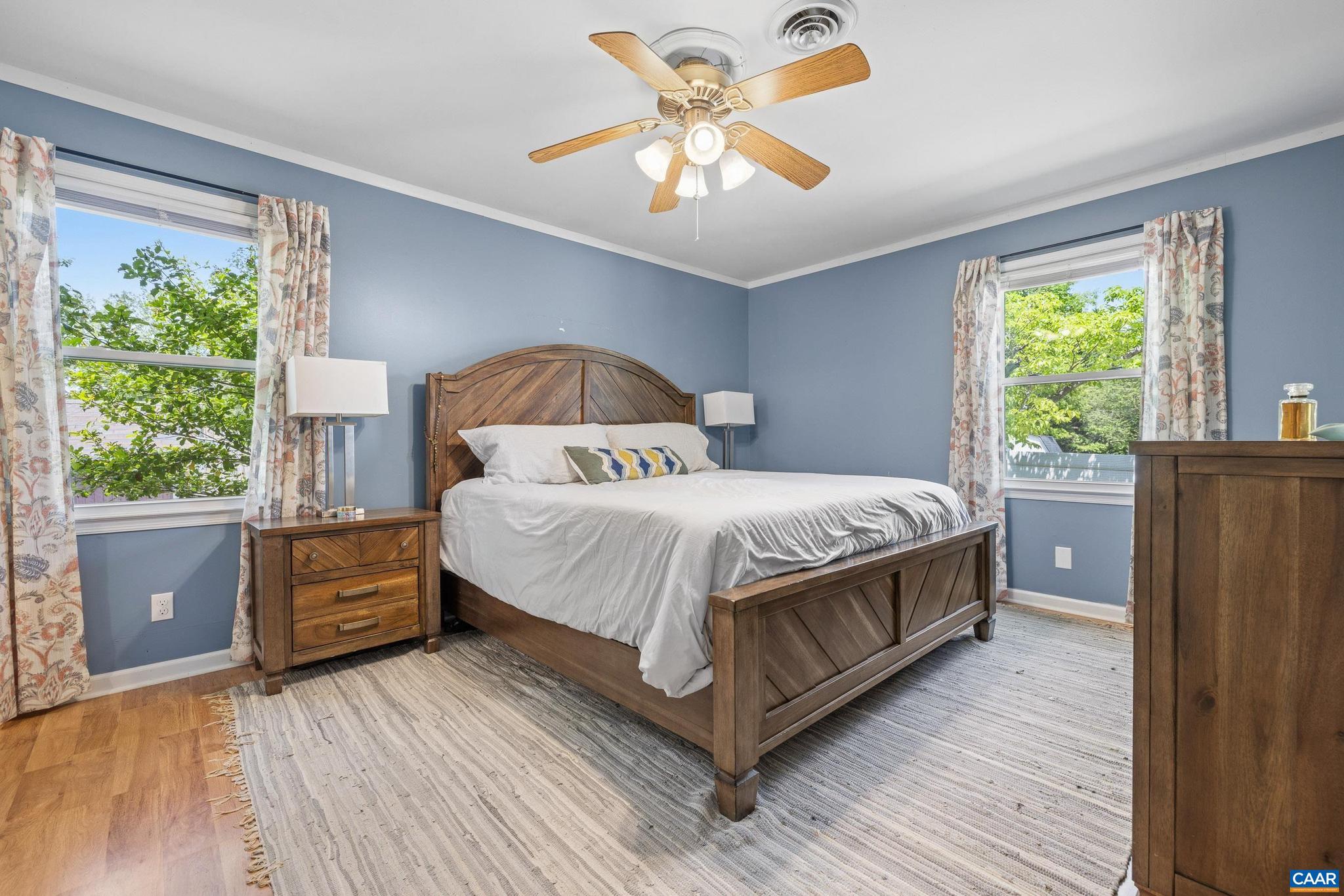 752 Westwood Road Stanardsville, VA 22973 - Photo 33 of 63 a bedroom with a bed and a dresser next to a window