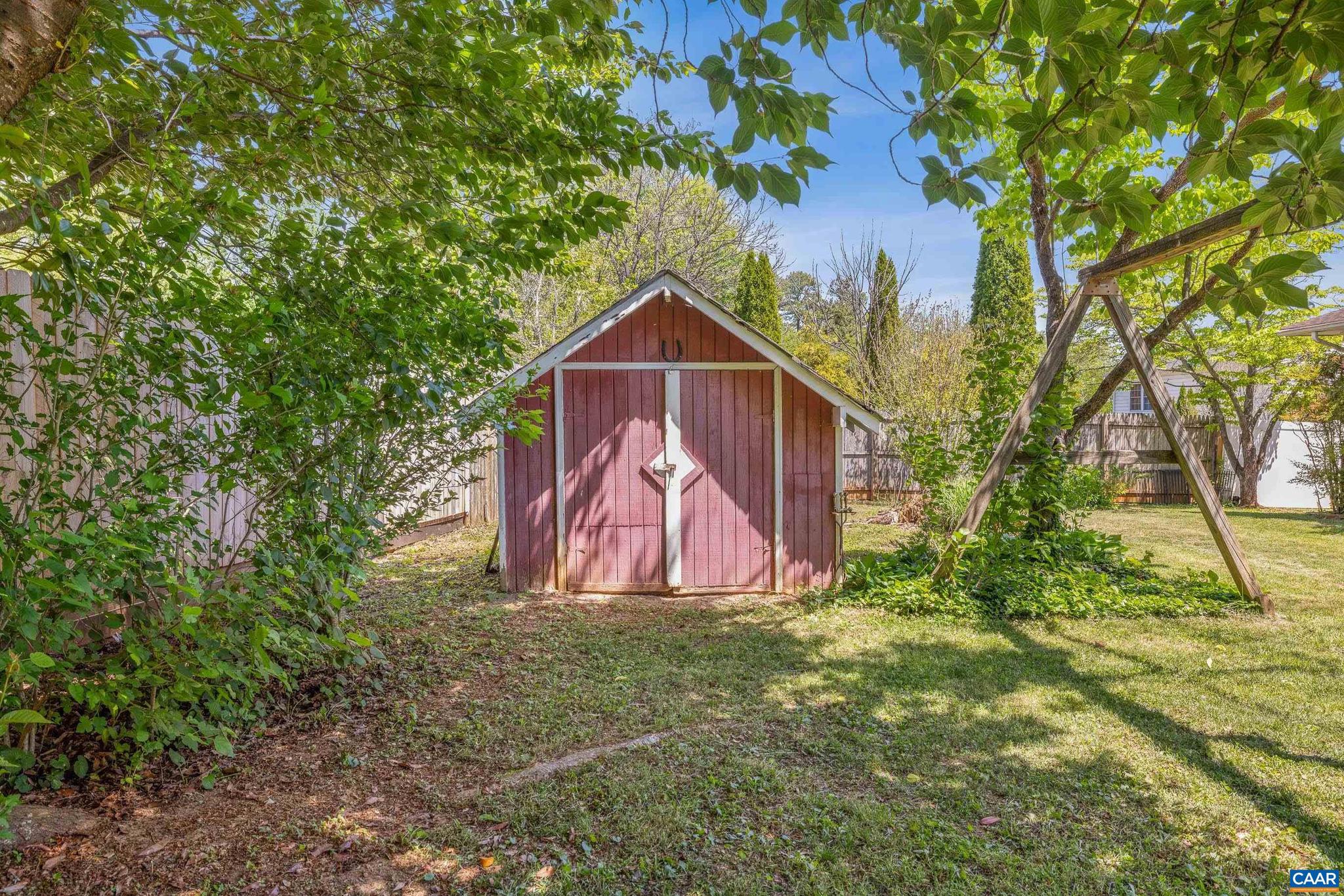 752 Westwood Road Stanardsville, VA 22973 - Photo 38 of 63 a view of a backyard with a tree and wooden fence