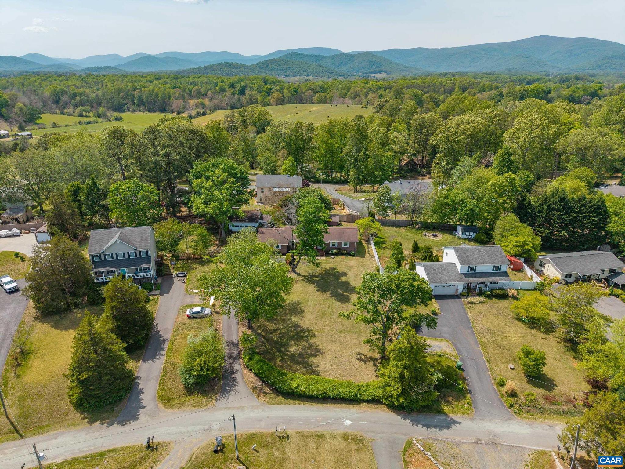 752 Westwood Road Stanardsville, VA 22973 - Photo 46 of 63 an aerial view of green landscape with trees houses and lake view