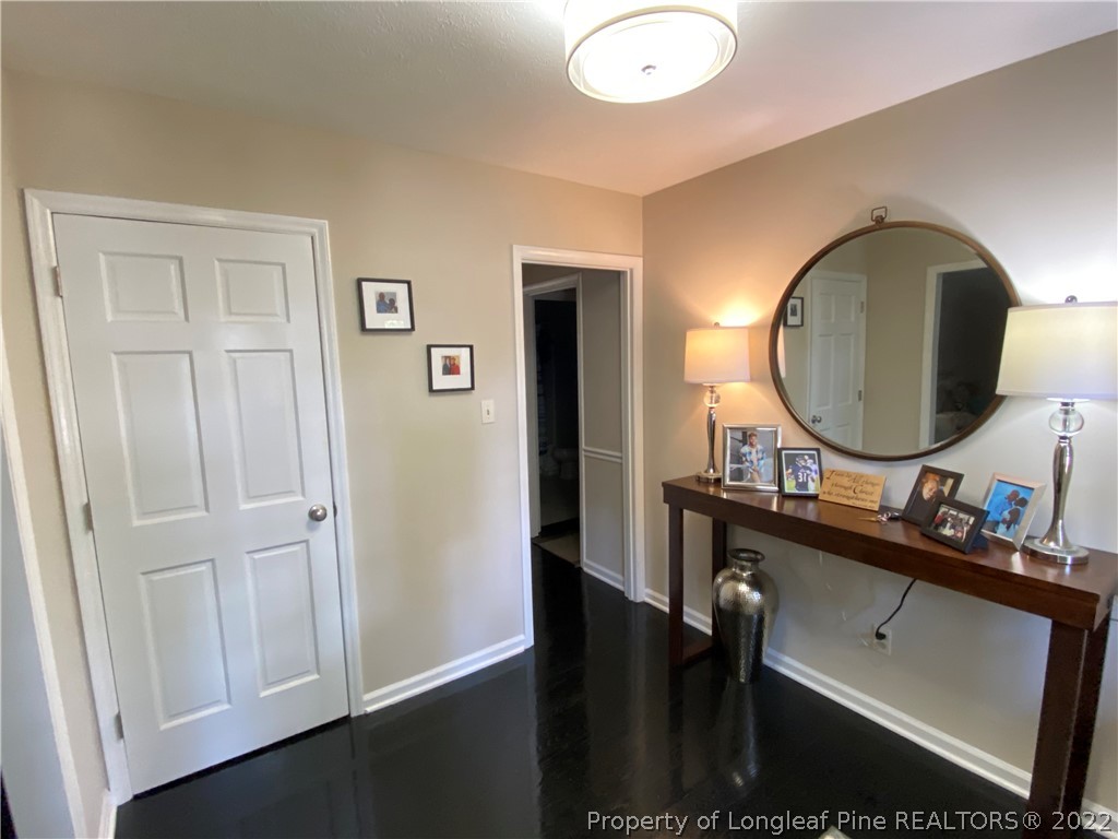215 Rivenoak Drive Fayetteville, NC 28303 - Photo 3 of 21 a bathroom with a sink vanity and a mirror