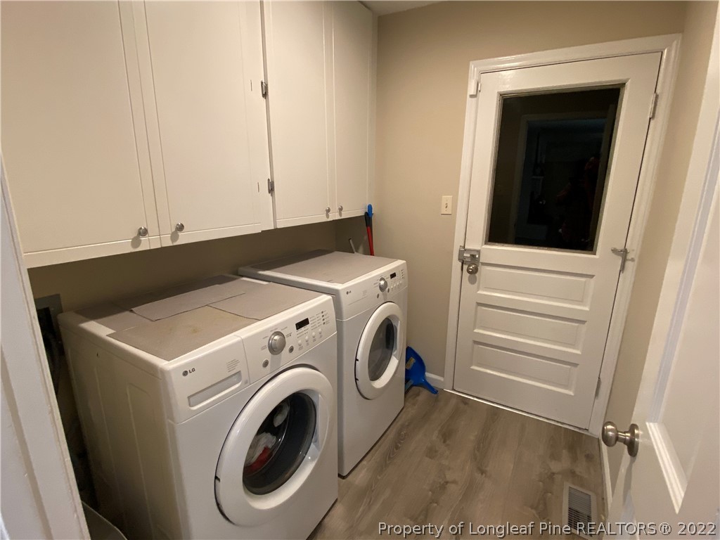 215 Rivenoak Drive Fayetteville, NC 28303 - Photo 7 of 21 a utility room with dryer and washer