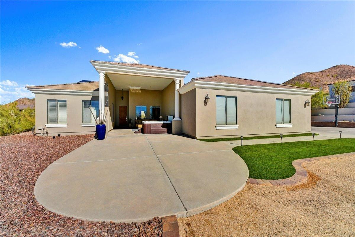 412 East Yearling Road Phoenix, AZ 85085 - Photo 49 of 51 front view of a house with a garden