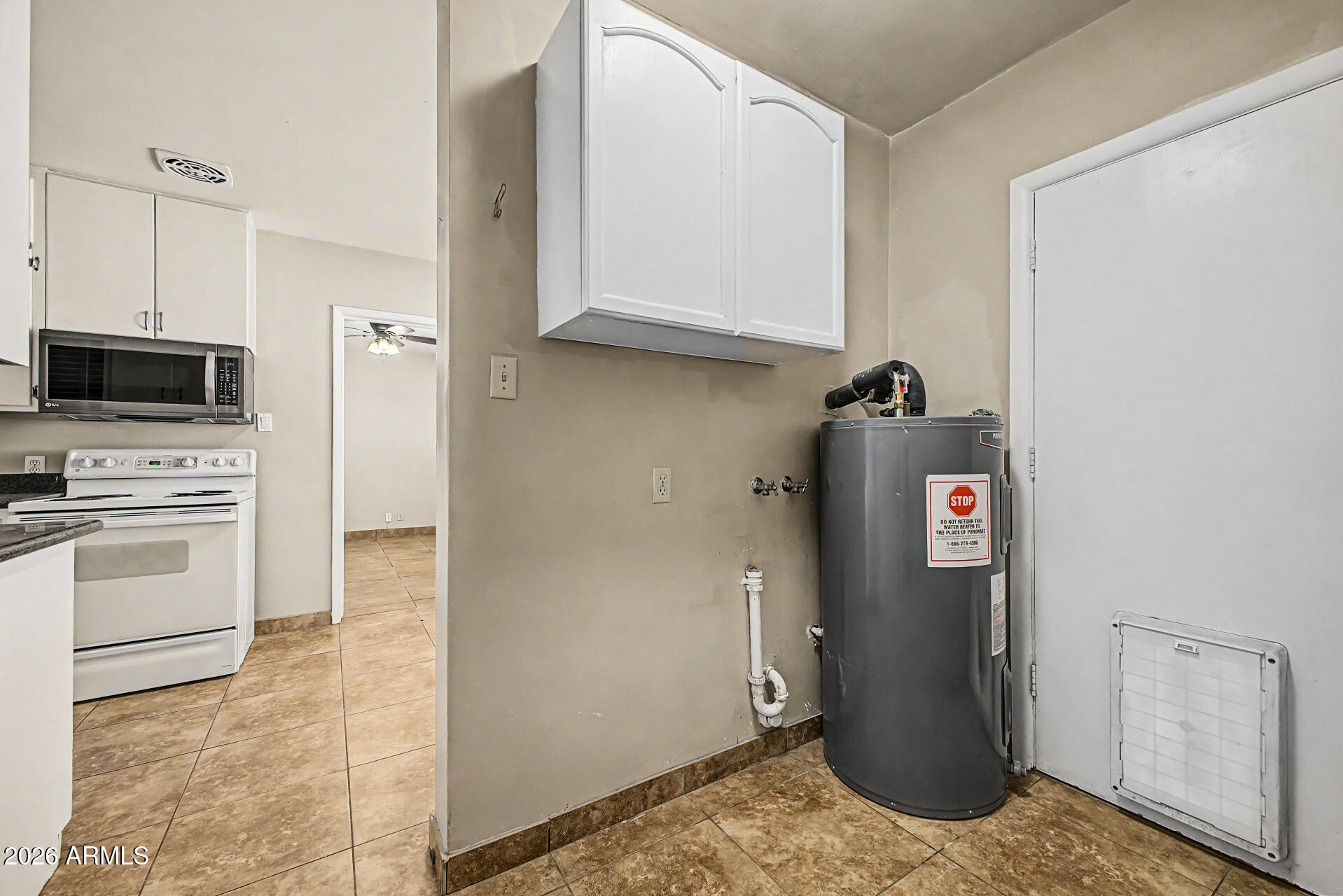2022 East Monterey Way Phoenix, AZ 85016 - Photo 22 of 29 a kitchen with a refrigerator and a stove