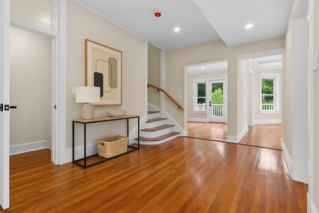 31 George Street, Unit 31 Newton, MA 02458 - Photo 7 of 10 a view of empty room with wooden floor and fan