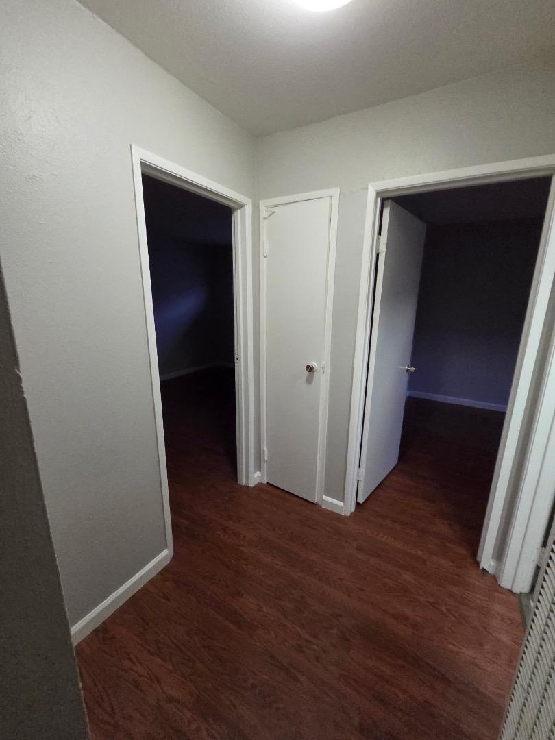 5745 Almaden Road, Unit D San Jose, CA 95118 - Photo 4 of 11 an empty room with wooden floor and closet