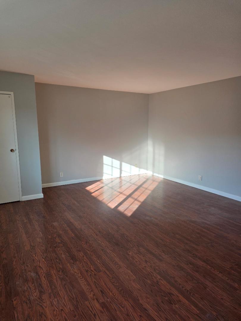 5745 Almaden Road, Unit D San Jose, CA 95118 - Photo 8 of 11 a view of empty room with wooden floor