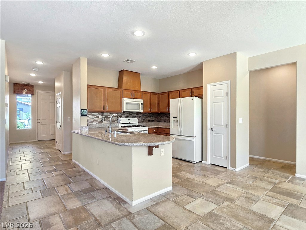 2485 Morrow Ridge Place Laughlin, NV 89029 - Photo 10 of 38 A well-appointed kitchen showcasing an inviting island and sleek appliances.