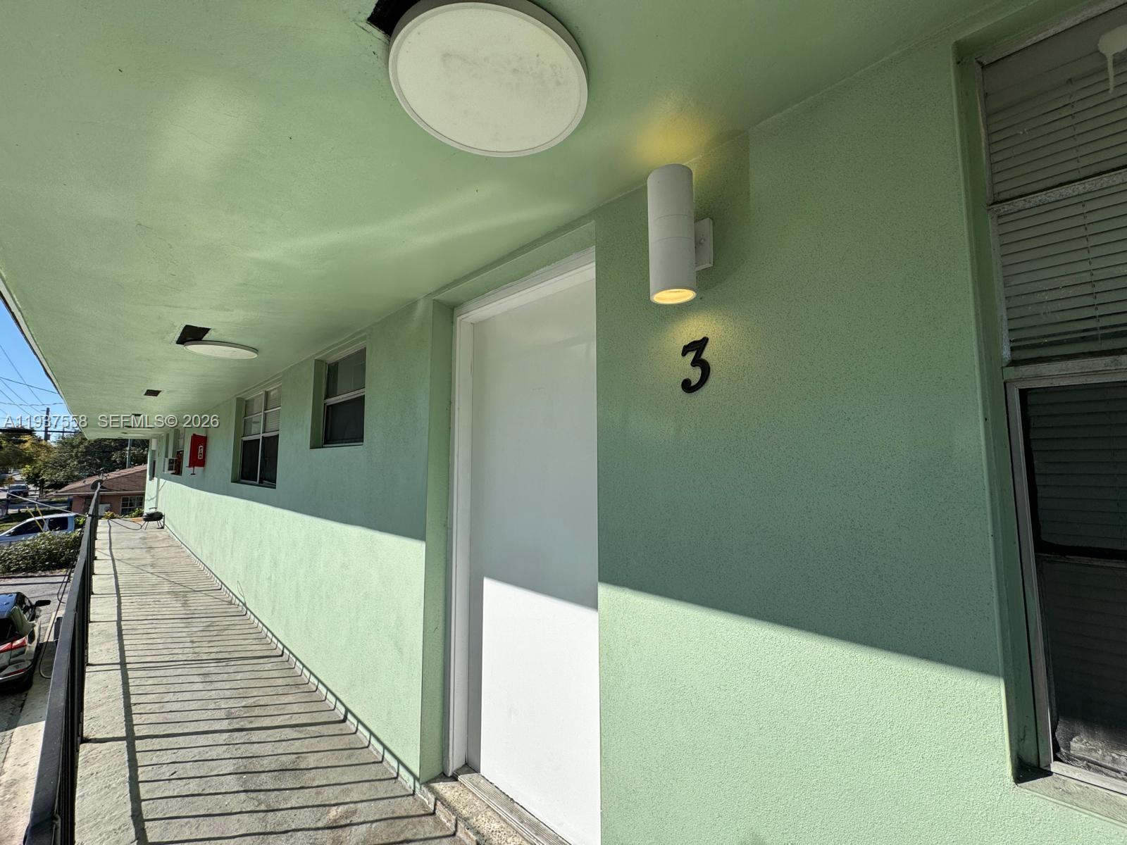 201 Northwest 77th Street, Unit 3 Miami, FL 33150 - Photo 15 of 15 a bathroom with a sink and a mirror