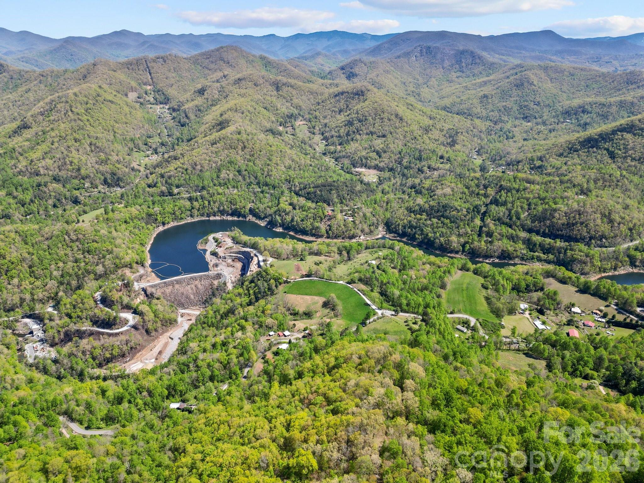 0 Oat Field Road, Unit 5B Tuckasegee, NC 28783 - Photo 12 of 17 a view of a lush green field with mountains in the background