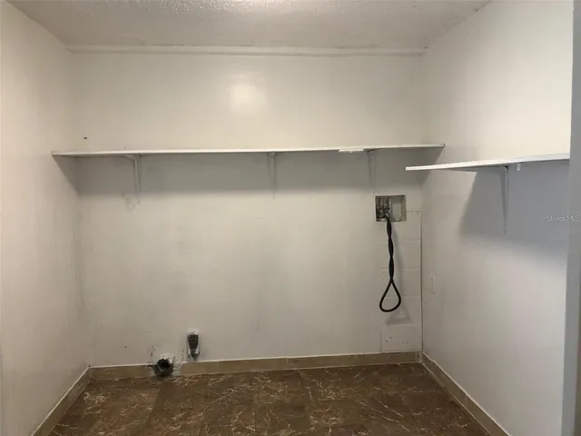 a view of small space with racks on the wall