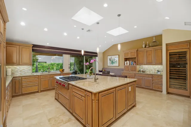 a kitchen with a stove and a refrigerator
