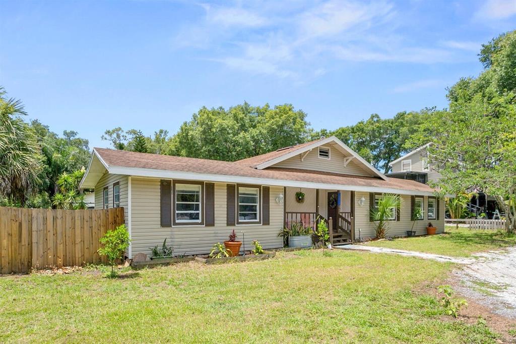 1211 West Windhorst Road Brandon, FL 33510 - Photo 1 of 1 a front view of a house with a yard
